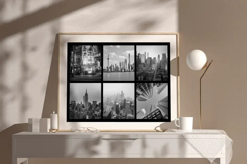 Zwart-witfotocollage van steden in een houten lijst op een licht dressoir, een cadeau als herinnering aan een reis